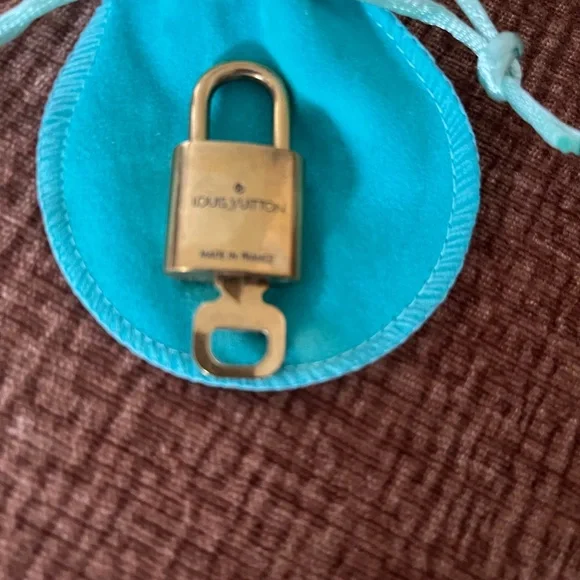Louis Vuitton Gold Padlock with Turquoise Pouch - Picture 2 of 2